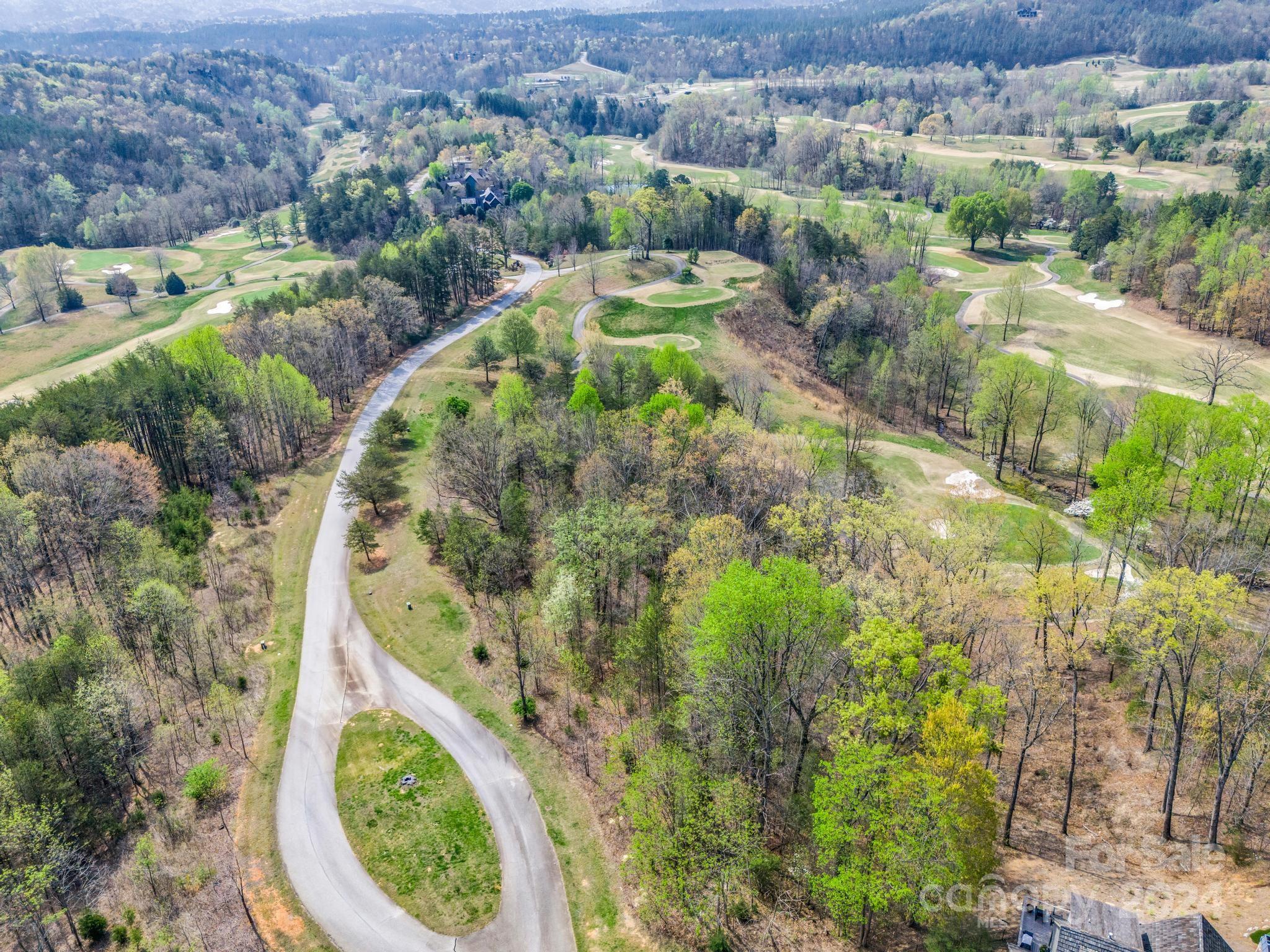 0 Chestertown Drive Mill Spring, NC 28756 - Photo 4 of 34 an aerial view of a house with a yard and lake view