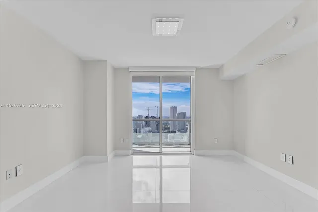 a bathroom with a double vanity sink and mirror with toilet