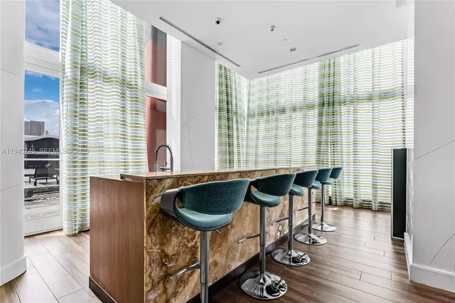 a view of a hallway with wooden shelves