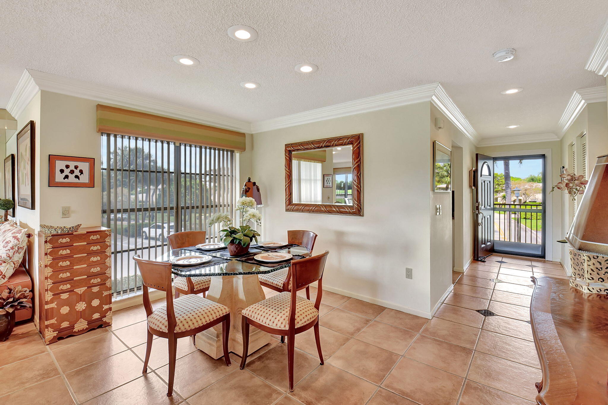3 Stratford Drive, Unit H Boynton Beach, FL 33436 - Photo 11 of 81 a dining room with furniture and a floor to ceiling window
