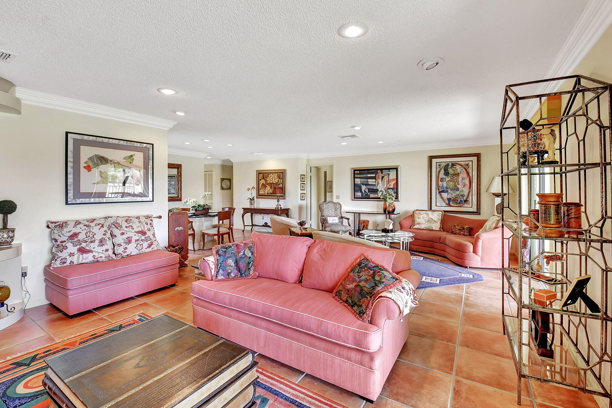 3 Stratford Drive, Unit H Boynton Beach, FL 33436 - Photo 20 of 81 a living room with furniture ceiling fan and a rug