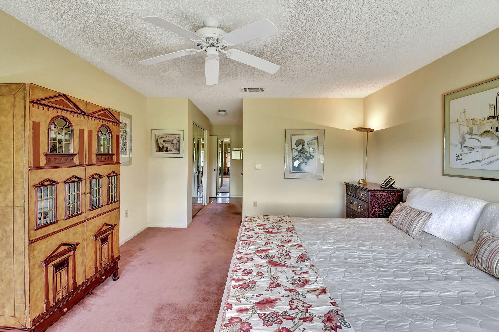 3 Stratford Drive, Unit H Boynton Beach, FL 33436 - Photo 23 of 81 a bedroom with a large bed and a chandelier