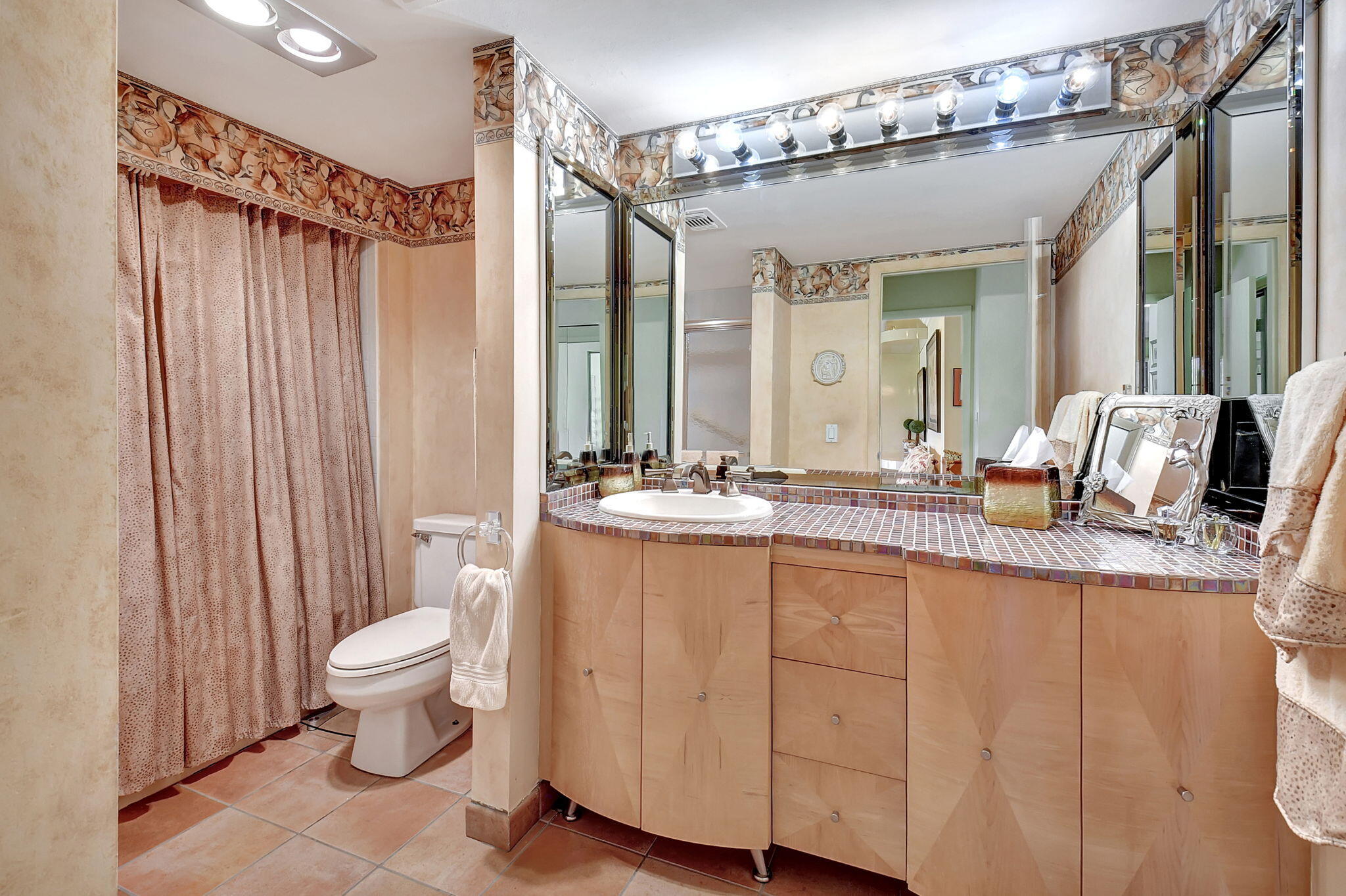 3 Stratford Drive, Unit H Boynton Beach, FL 33436 - Photo 25 of 81 a bathroom with a double vanity sink toilet mirror and shower