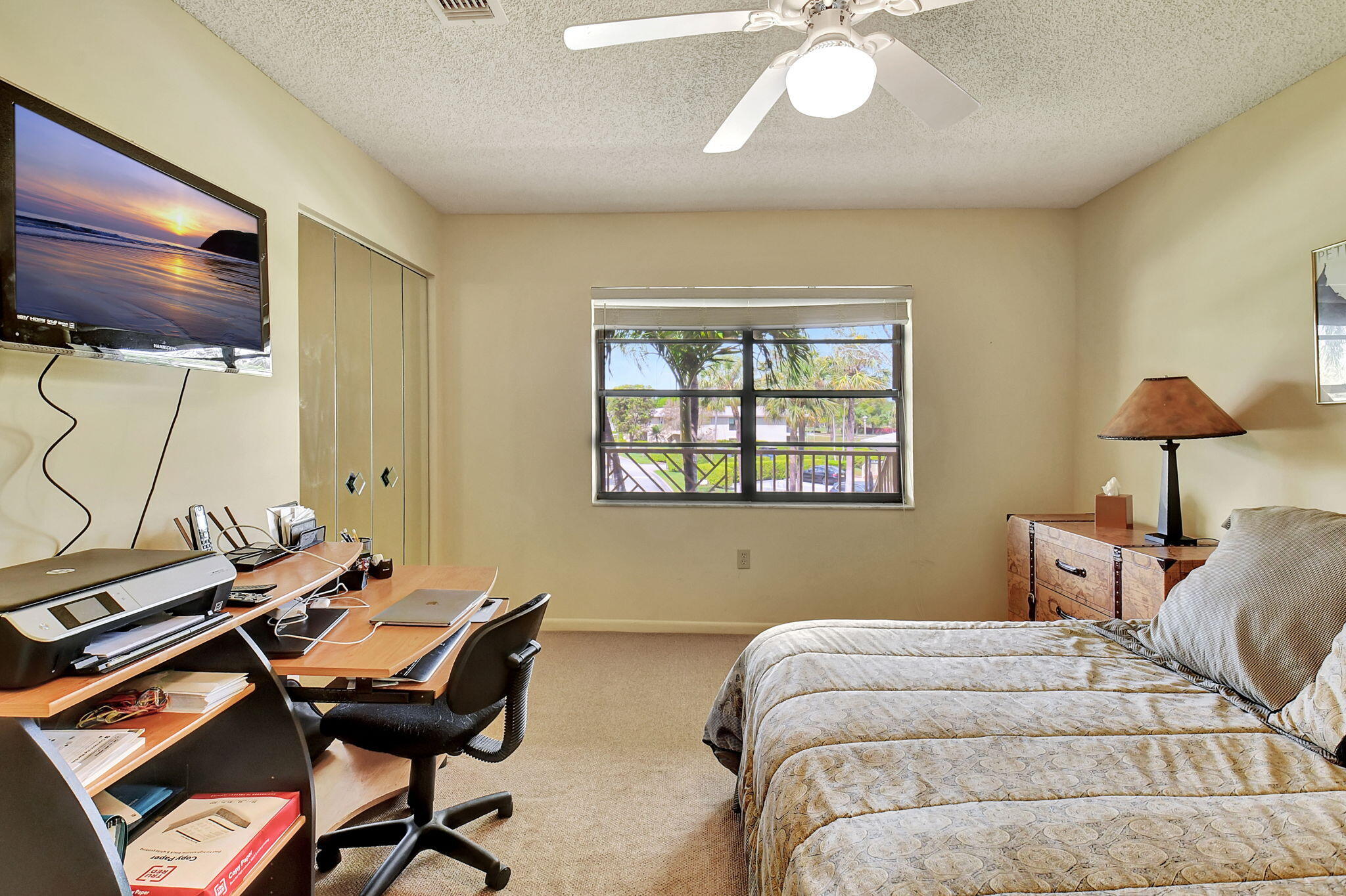 3 Stratford Drive, Unit H Boynton Beach, FL 33436 - Photo 27 of 81 a bedroom with a bed and a chandelier