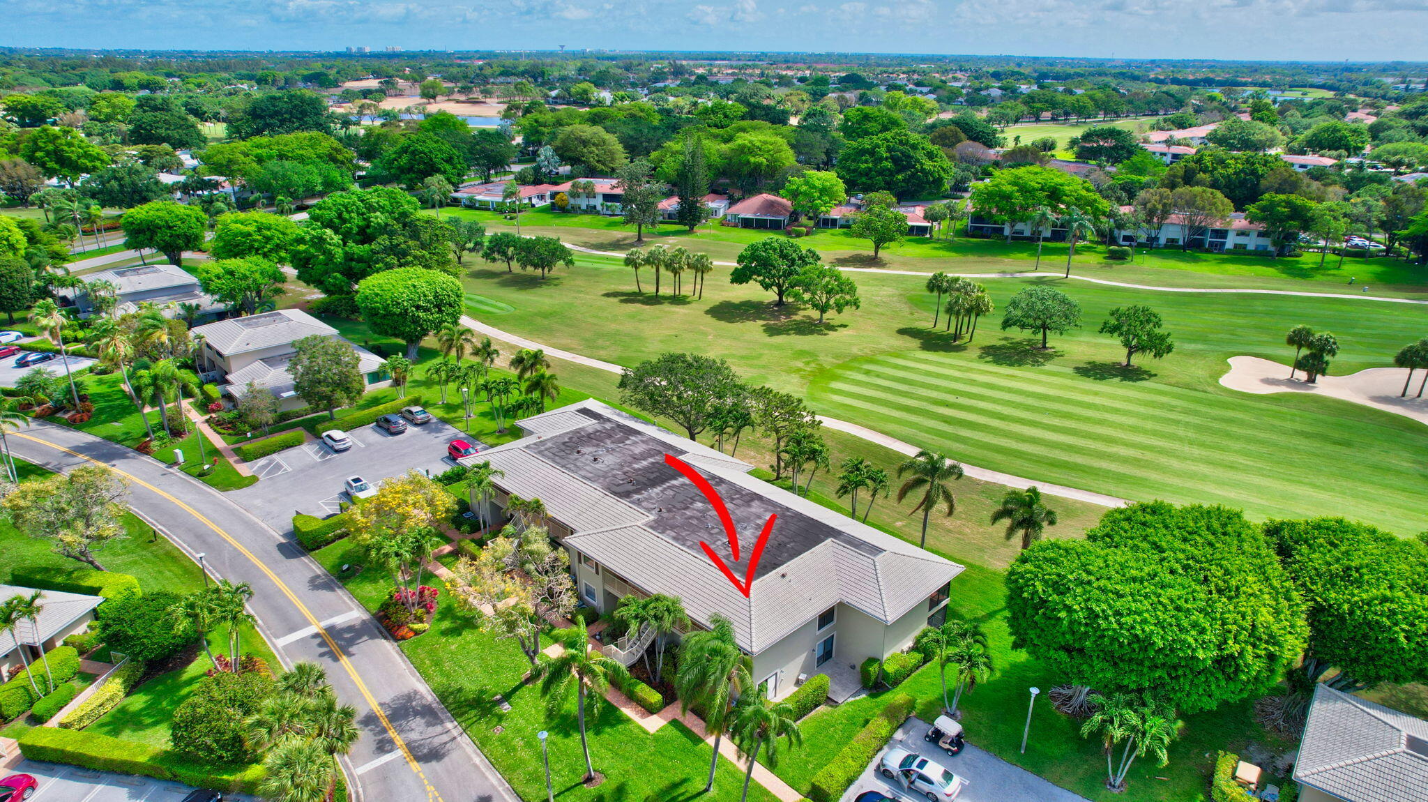 3 Stratford Drive, Unit H Boynton Beach, FL 33436 - Photo 43 of 81 a green field with lots of trees in the background