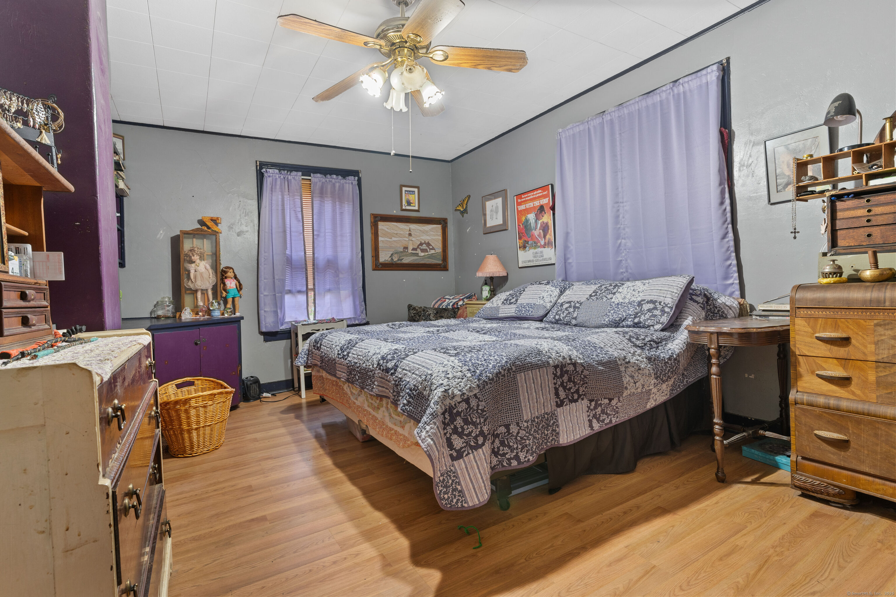 104 Judson Street Thomaston, CT 06787 - Photo 15 of 24 a spacious bedroom with a bed and a chandelier