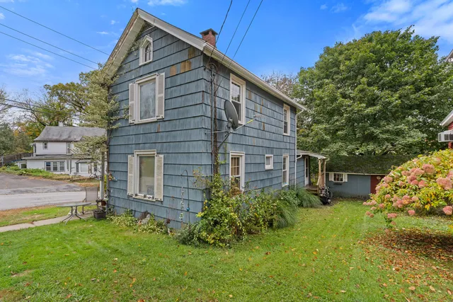 a backyard of a house with lots of green space