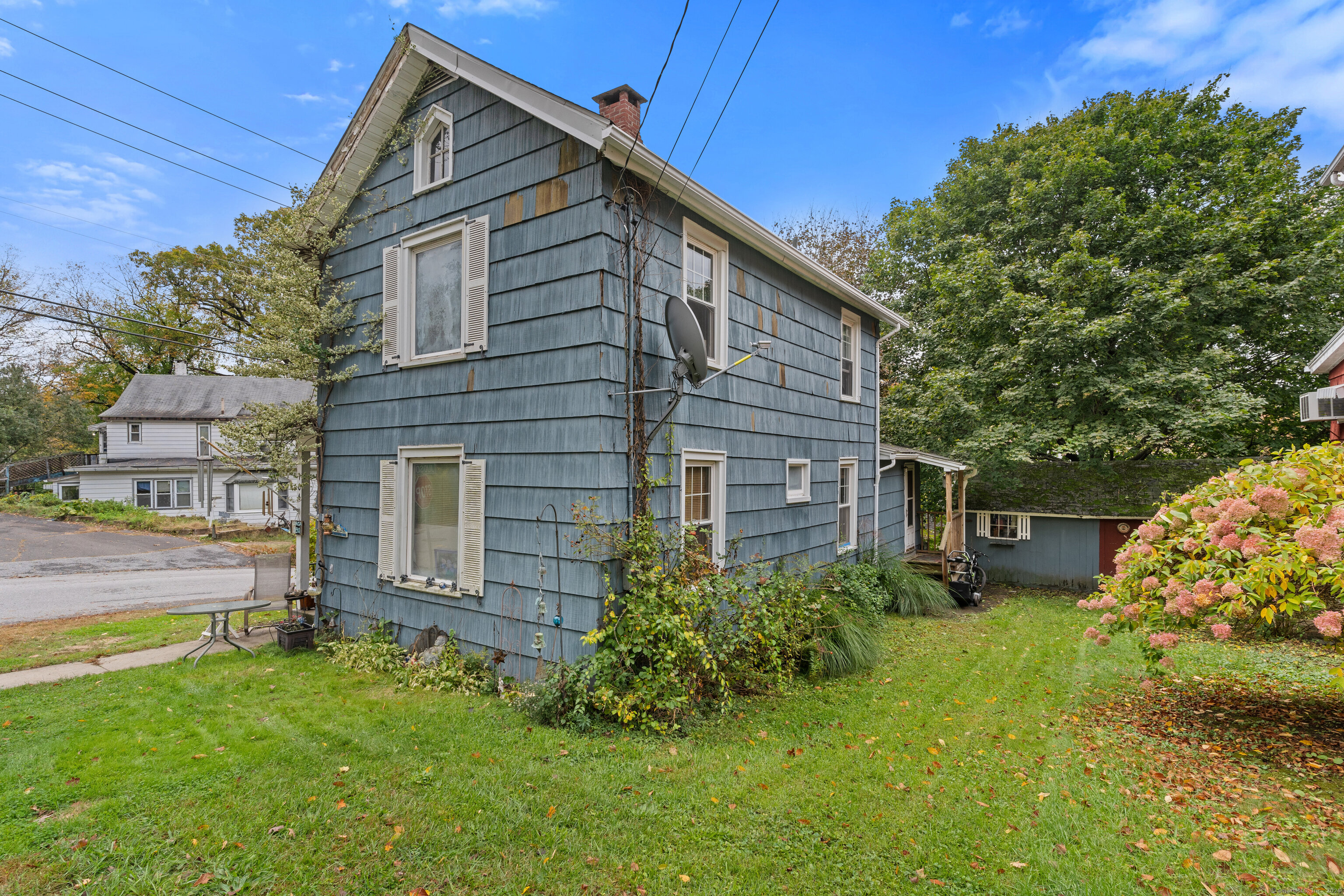 104 Judson Street Thomaston, CT 06787 - Photo 2 of 24 a backyard of a house with lots of green space