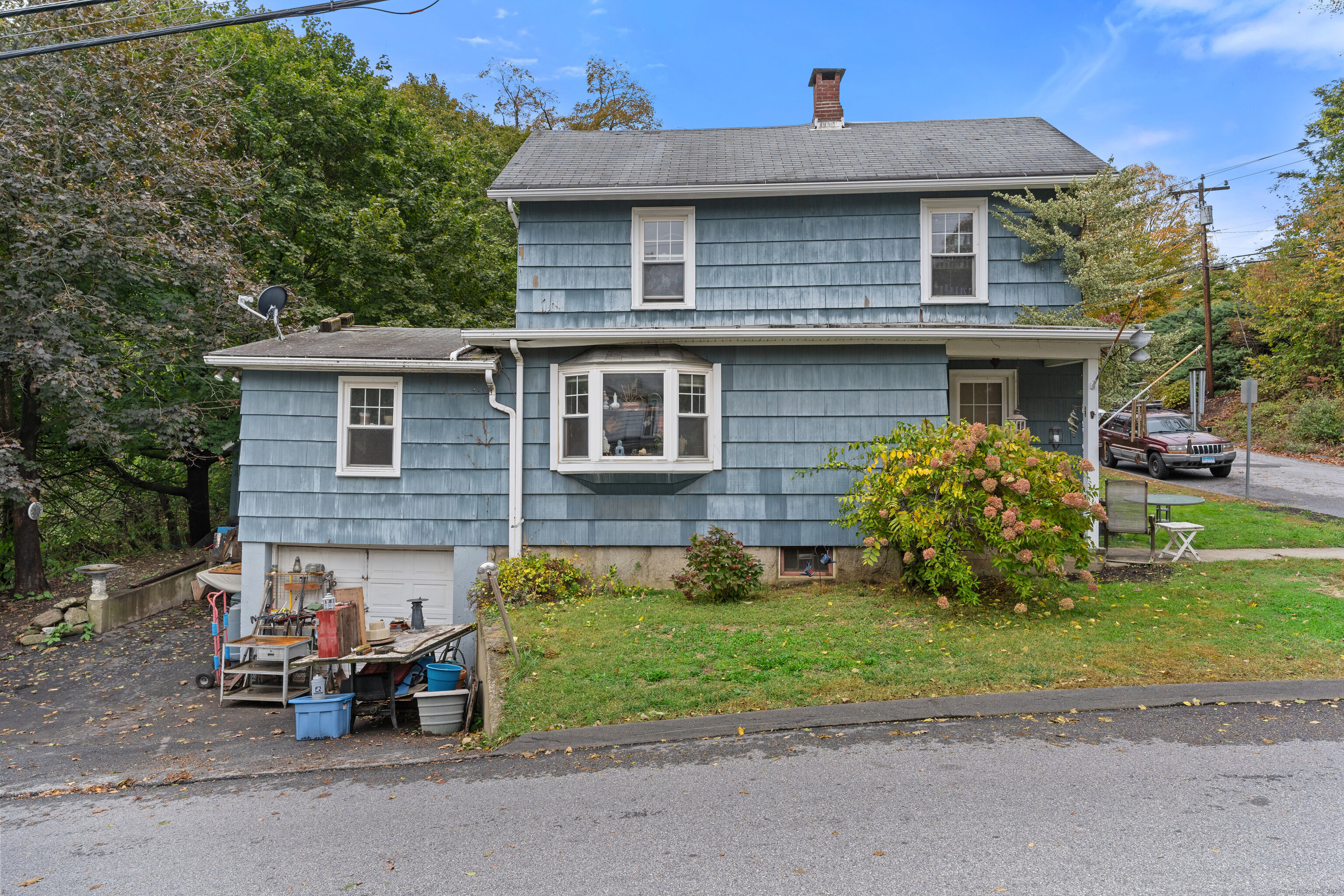 104 Judson Street Thomaston, CT 06787 - Photo 21 of 24 a front view of a house with garden