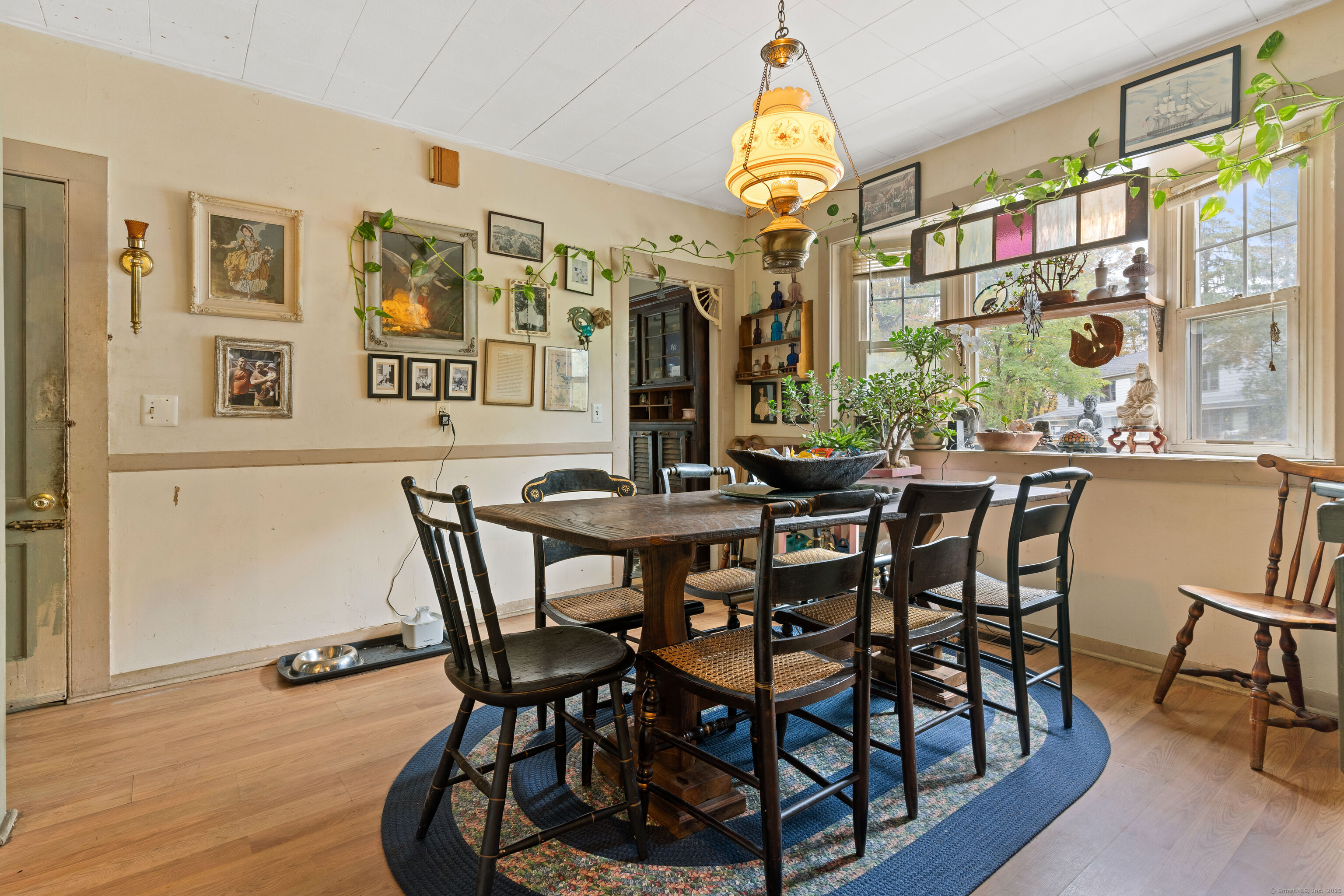 104 Judson Street Thomaston, CT 06787 - Photo 7 of 24 a view of a dining room with furniture and wooden floor