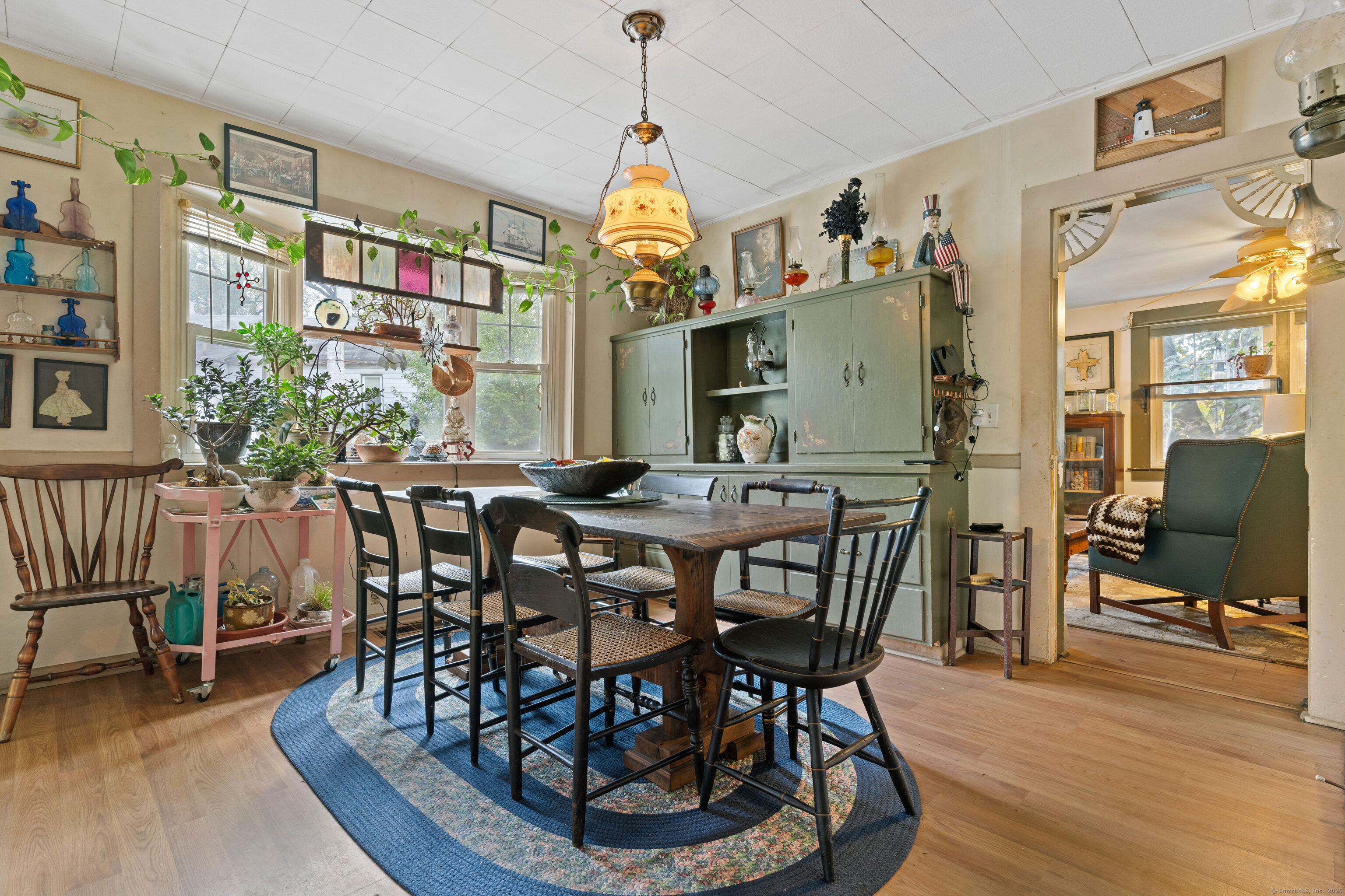 104 Judson Street Thomaston, CT 06787 - Photo 8 of 24 a view of a dining room with furniture window and wooden floor