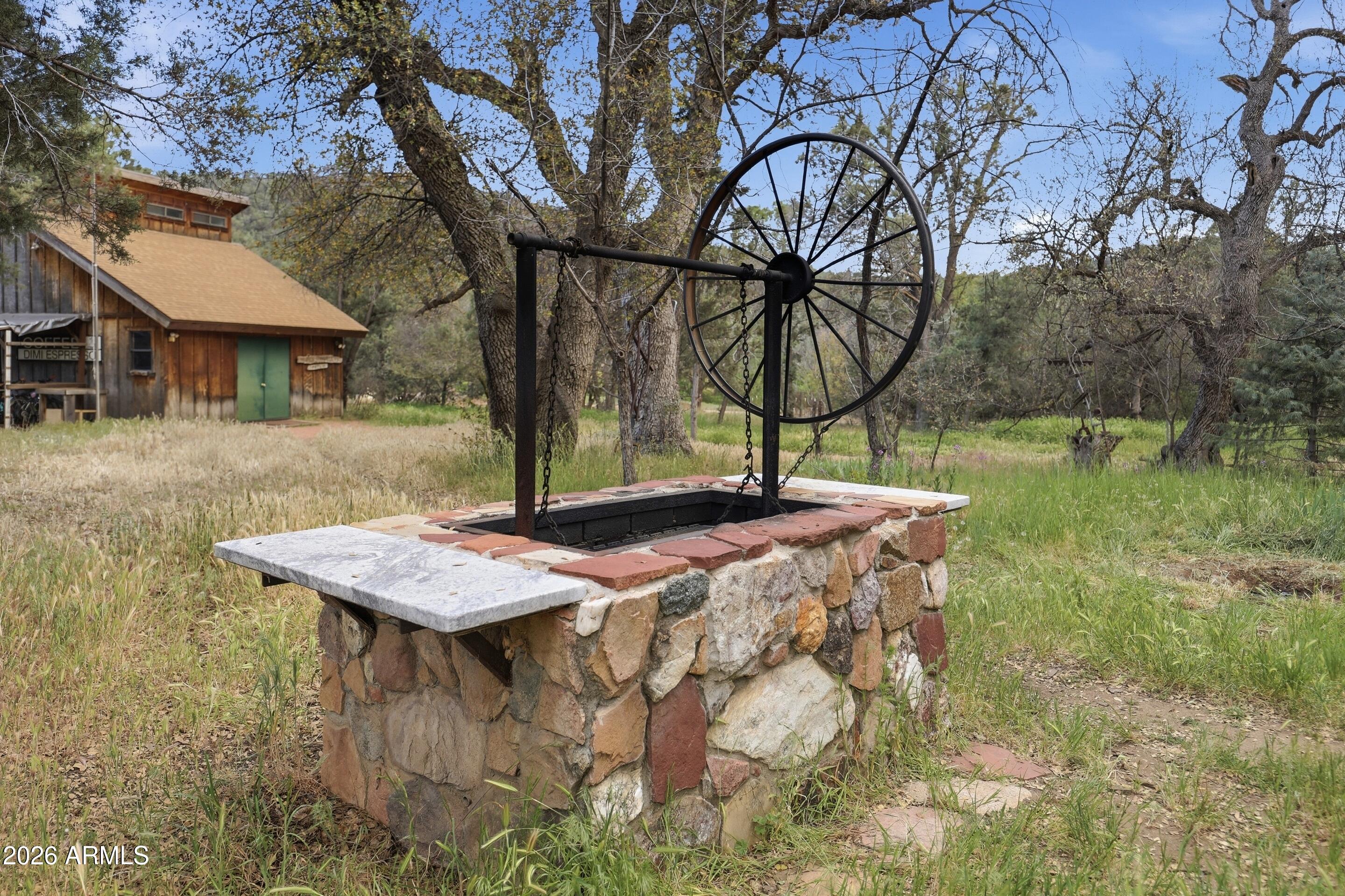 8135 West Gibson Ranch Road Payson, AZ 85541 - Photo 24 of 43 a view of an house with backyard space and a tree