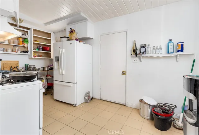 a view of a kitchen with appliances and cabinets