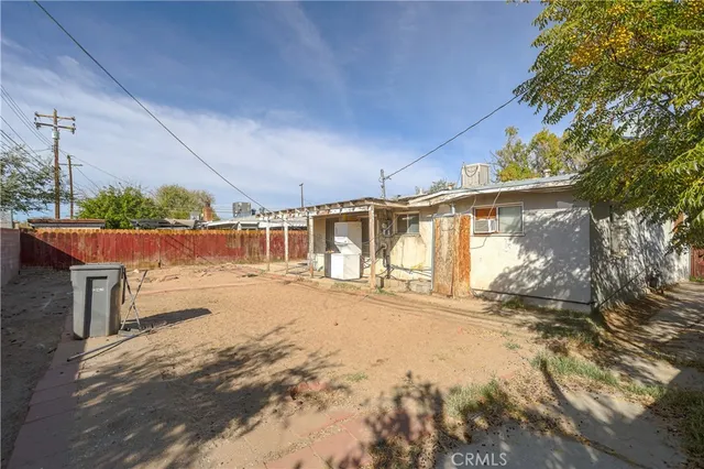 a view of a house with snow on the road