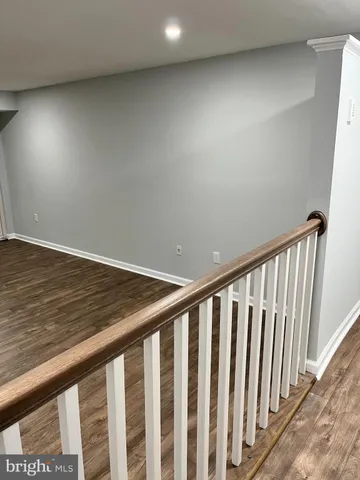 a view of staircase with wooden floor