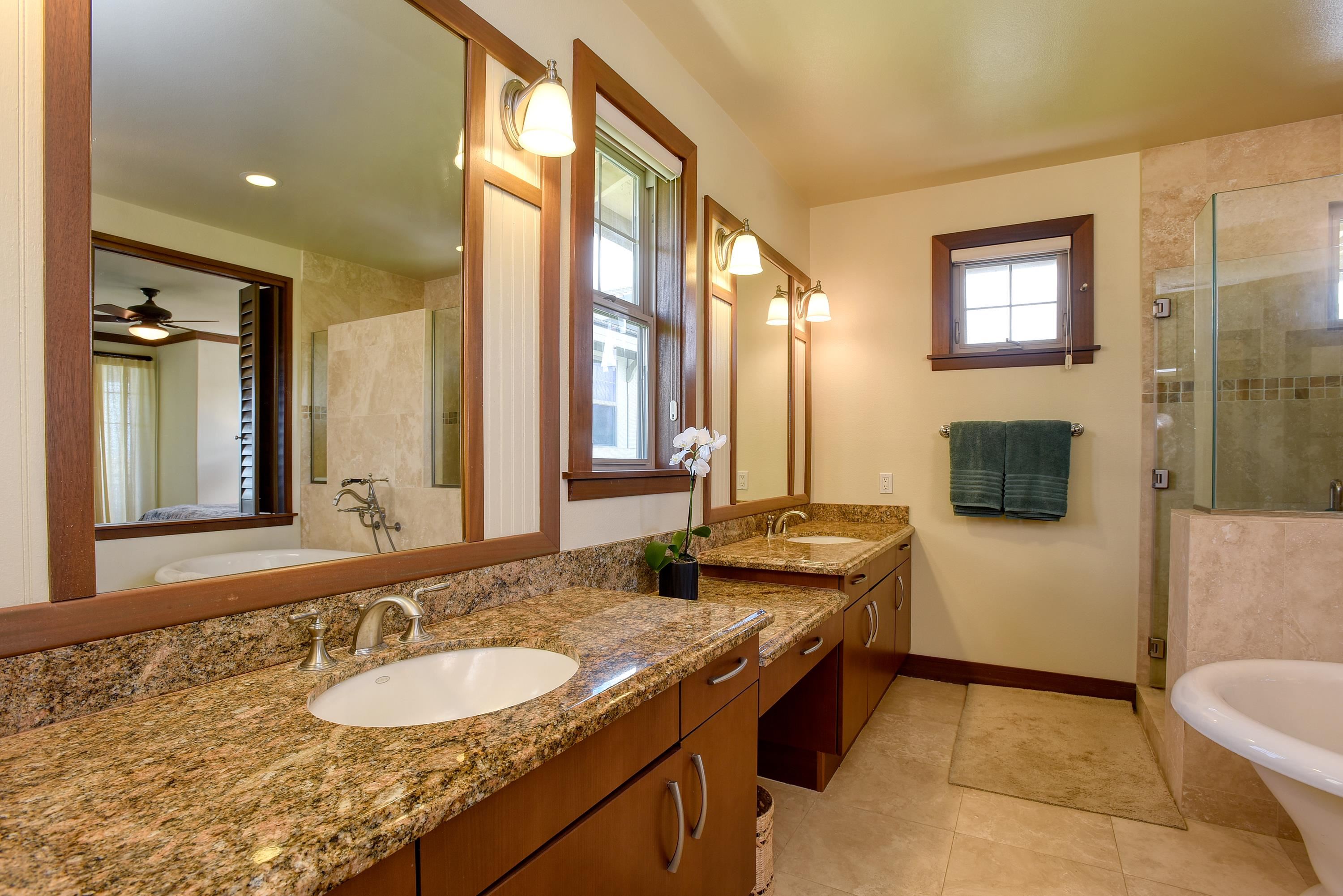 71 Poailani Place, Unit 14 Kihei, HI 96753 - Photo 11 of 23 a bathroom with a granite countertop sink and a mirror
