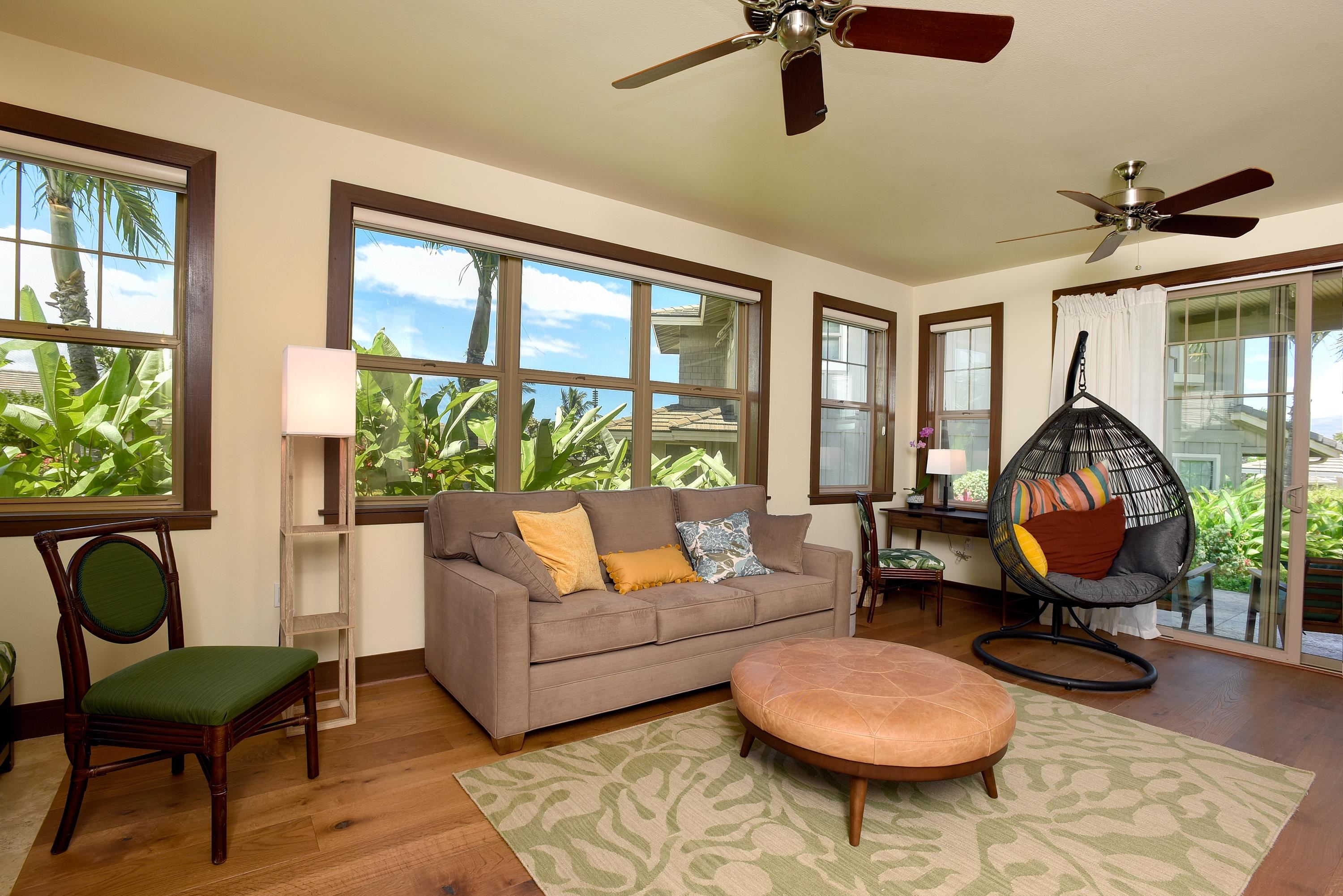 71 Poailani Place, Unit 14 Kihei, HI 96753 - Photo 16 of 23 a living room with furniture a rug and a window