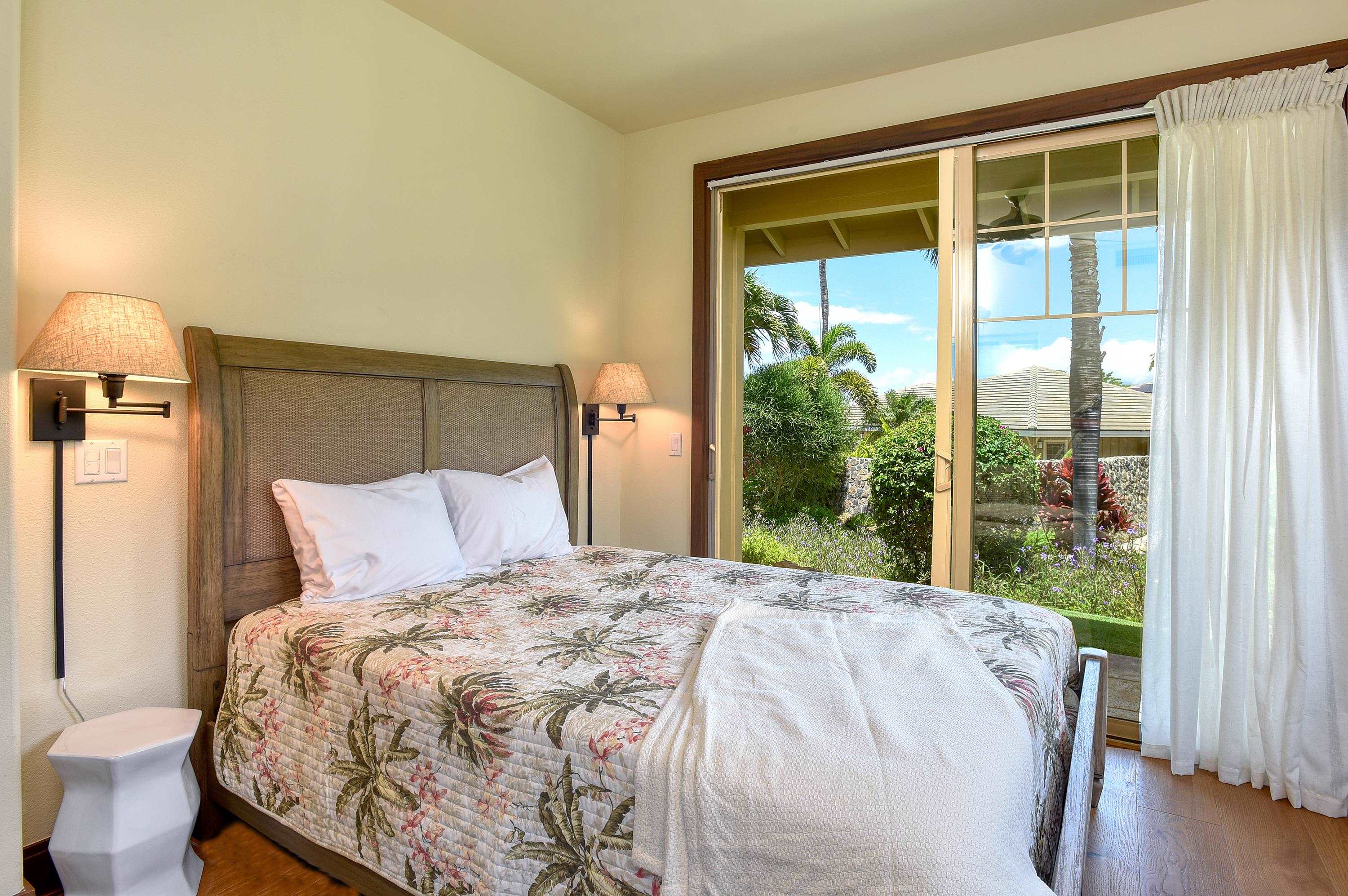 71 Poailani Place, Unit 14 Kihei, HI 96753 - Photo 17 of 23 a bed sitting in a bedroom next to a window