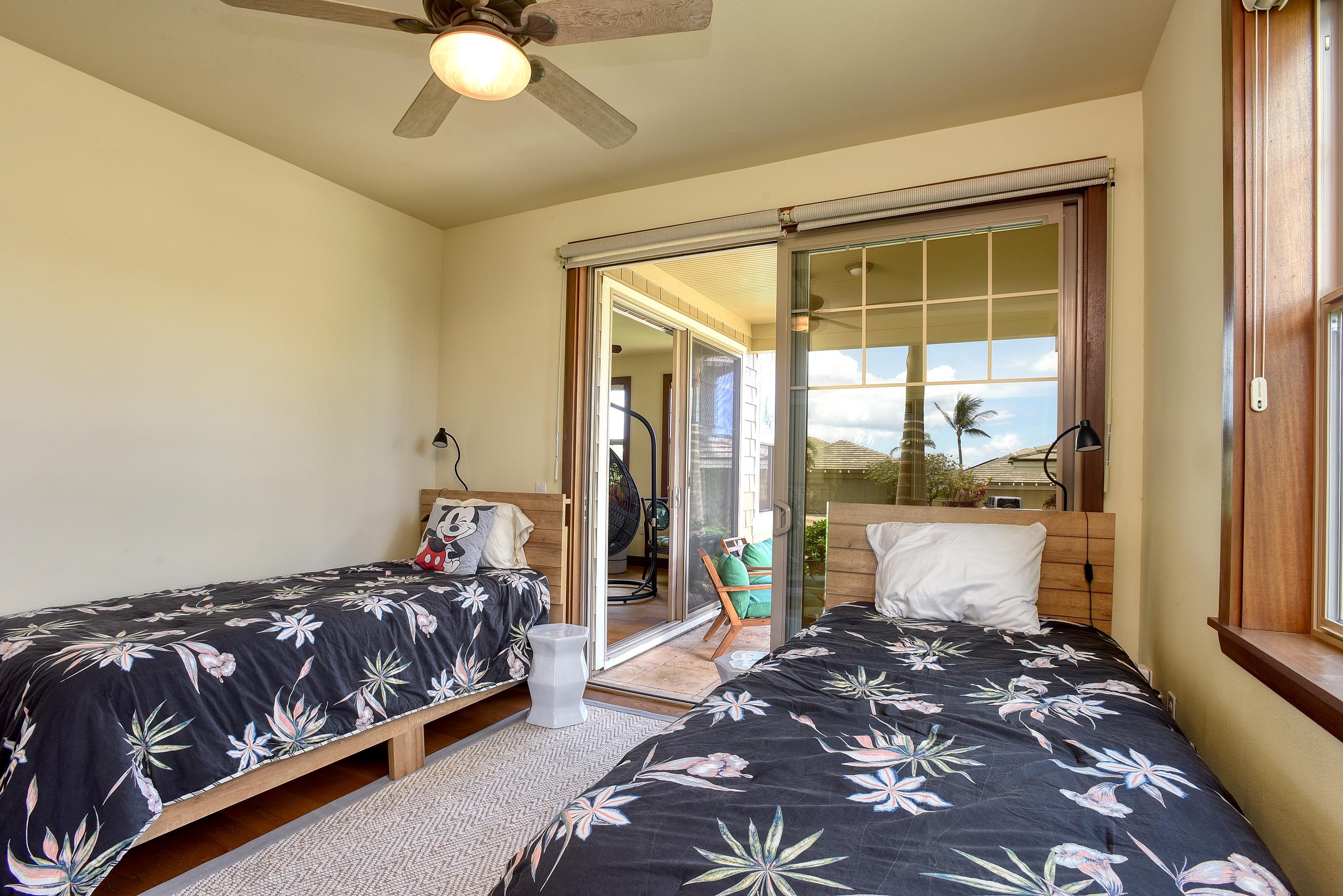 71 Poailani Place, Unit 14 Kihei, HI 96753 - Photo 18 of 23 a bedroom with a large bed and a large window
