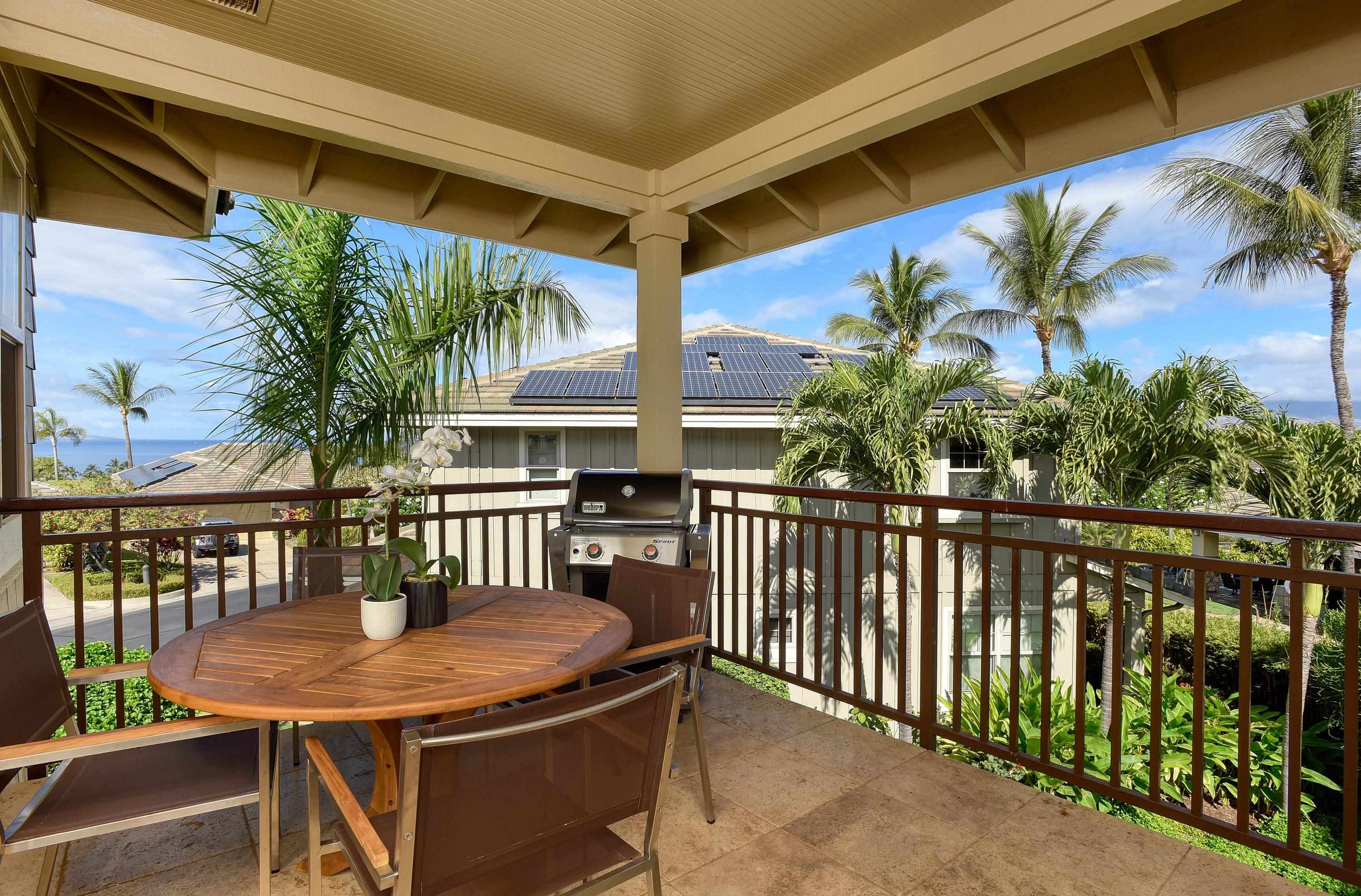 71 Poailani Place, Unit 14 Kihei, HI 96753 - Photo 4 of 23 a view of a balcony with a table and chairs