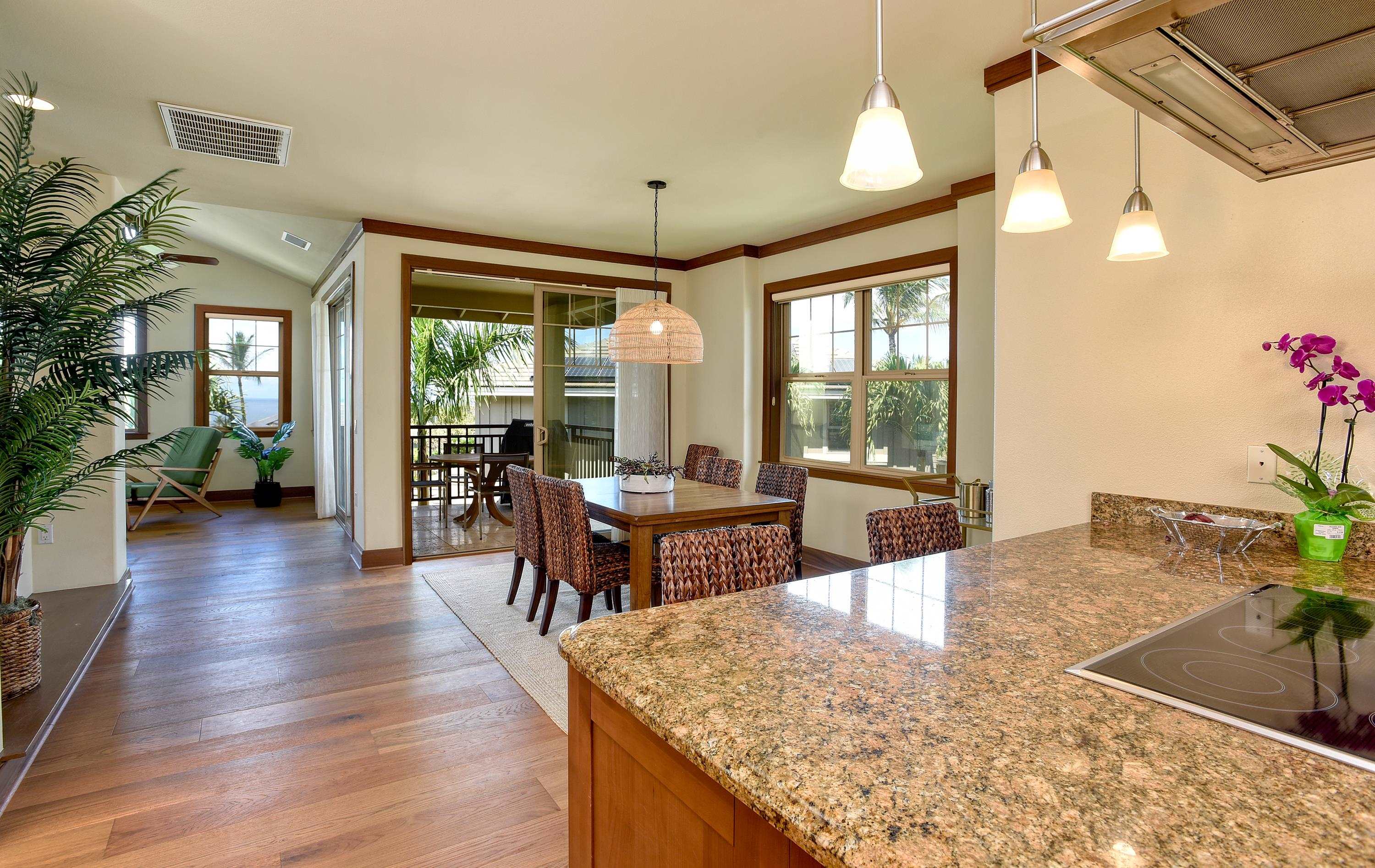 71 Poailani Place, Unit 14 Kihei, HI 96753 - Photo 8 of 23 a view of a dining room with furniture window and wooden floor