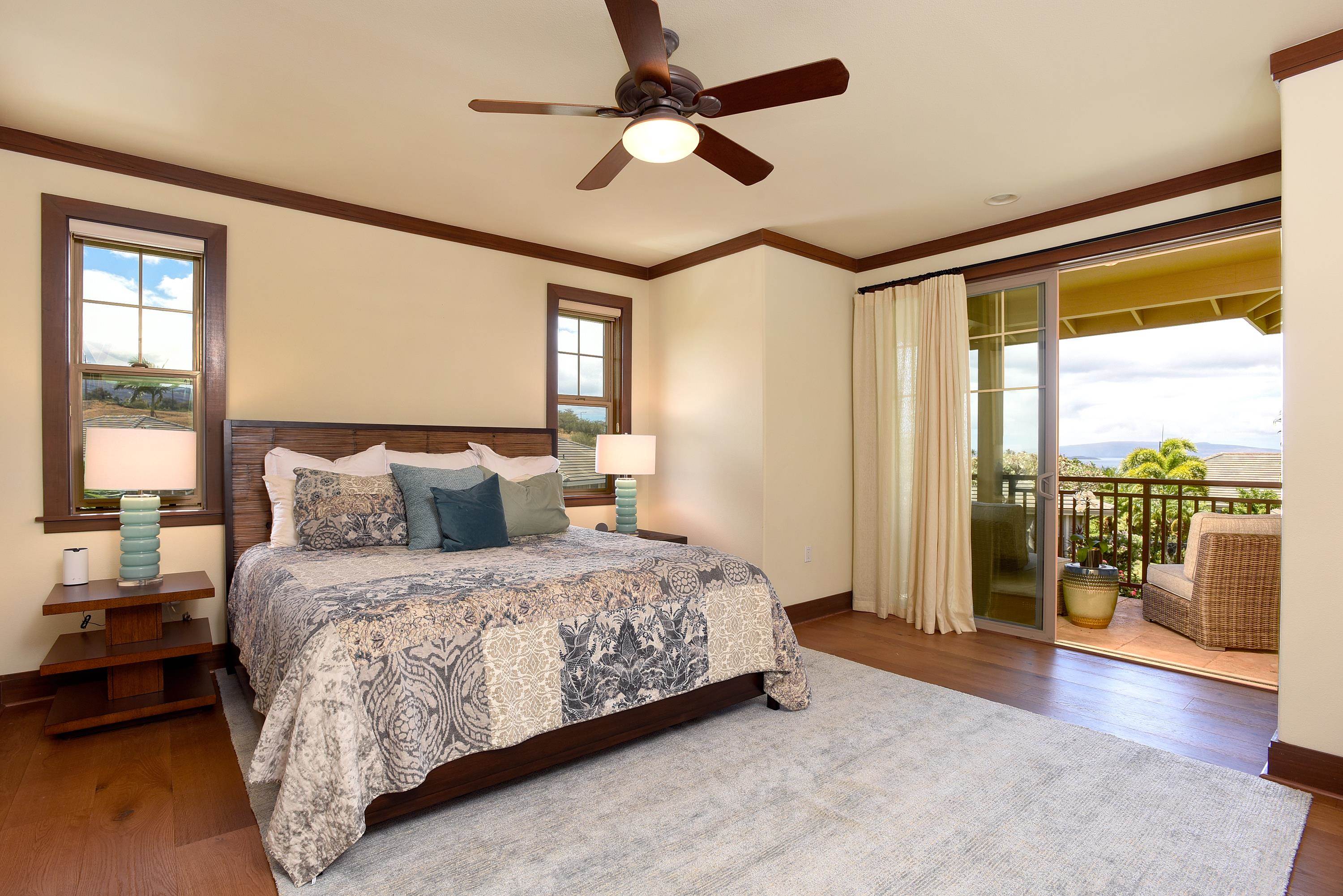 71 Poailani Place, Unit 14 Kihei, HI 96753 - Photo 9 of 23 a bedroom with a large bed and a large window