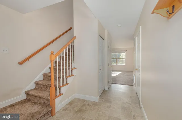 a view of an entryway with wooden floor