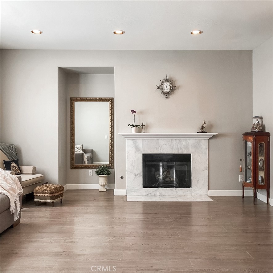 18 Avalon, Unit 5 Irvine, CA 92602 - Photo 5 of 6 a living room with furniture and a fireplace