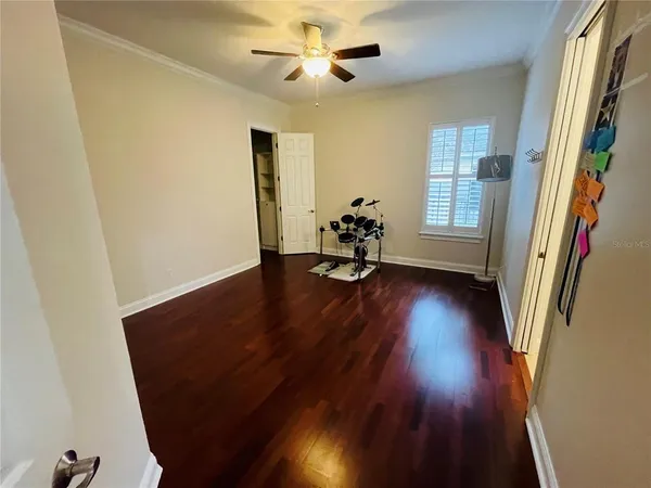 wooden floor in an empty room with a window