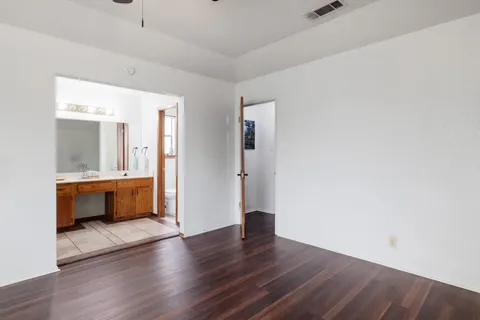 a bathroom with a double vanity sink and a mirror