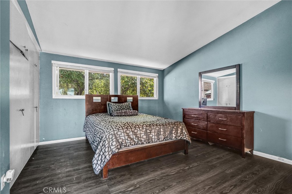 994 North Cleveland Street Orange, CA 92867 - Photo 27 of 53 a bedroom with a bed and wooden floor