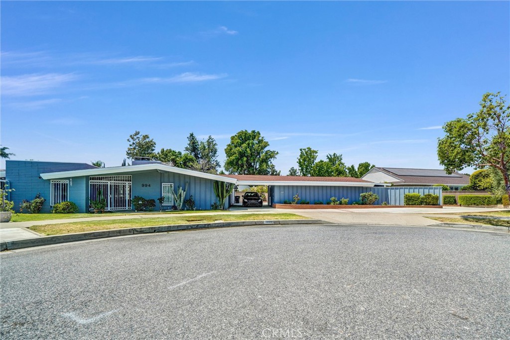 994 North Cleveland Street Orange, CA 92867 - Photo 3 of 53 a view of a house with a yard and plants