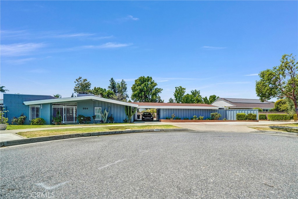 994 North Cleveland Street Orange, CA 92867 - Photo 3 of 53 a view of a house with a yard and plants