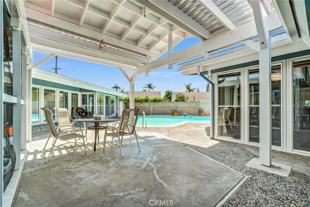 994 North Cleveland Street Orange, CA 92867 - Photo 34 of 53 a view of a porch with a table and chairs