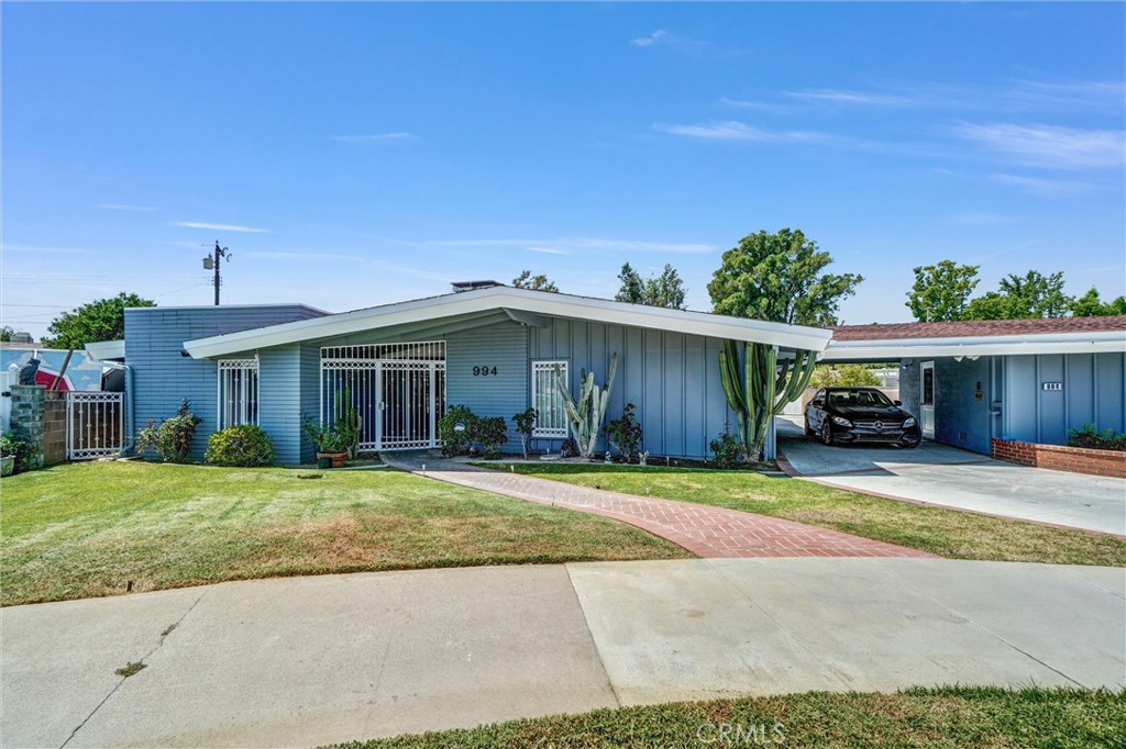 994 North Cleveland Street Orange, CA 92867 - Photo 35 of 53 a view of a house with a patio and a yard