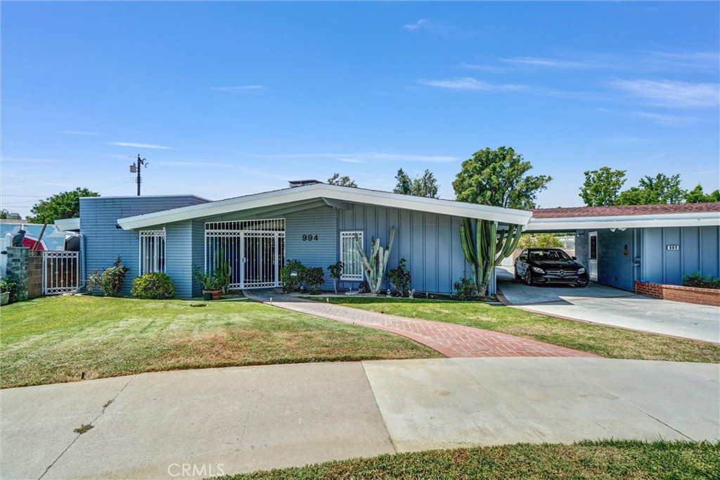 994 North Cleveland Street Orange, CA 92867 - Photo 35 of 53 a view of a house with a patio and a yard