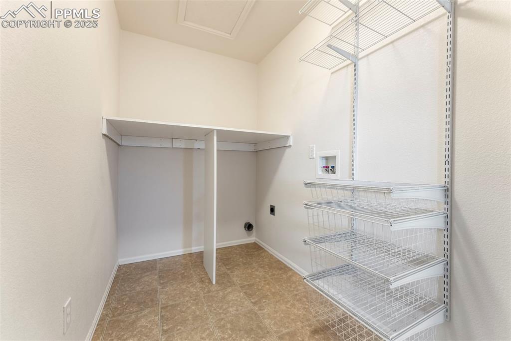 12210 Crystal Downs Road Peyton, CO 80831 - Photo 29 of 50 Laundry room with hookup for a washing machine and baseboards