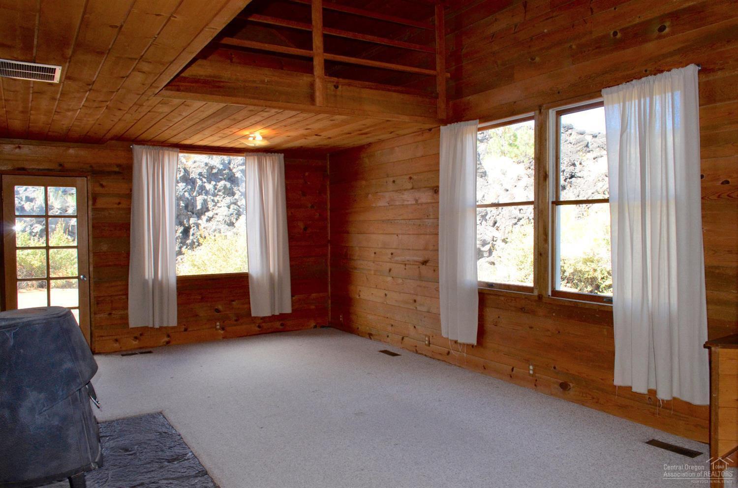 Living room with big windows letting in