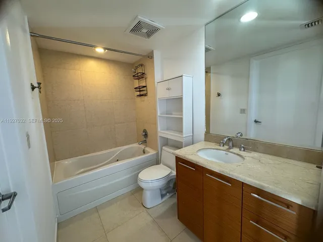 a bathroom with a toilet and a sink