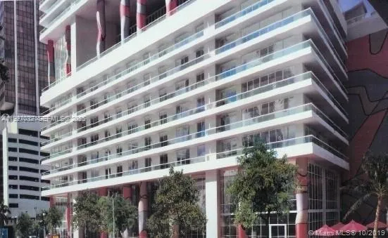 a living room with a bed furniture and a window