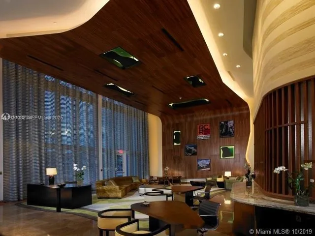 a view of a swimming pool with outdoor seating