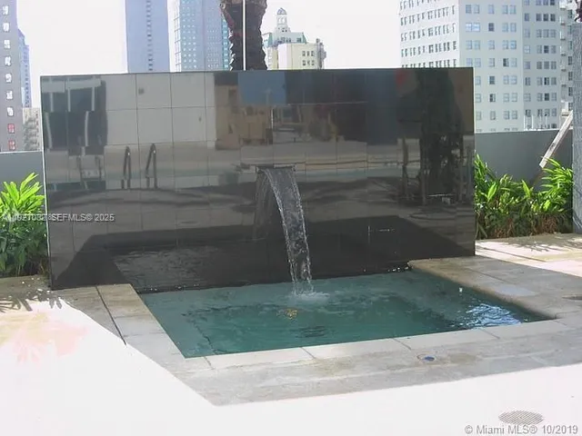 a building with palm trees in front of it