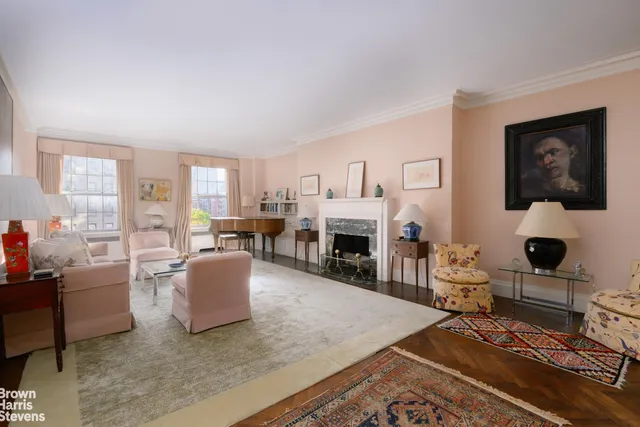 a living room with furniture a fireplace and a table