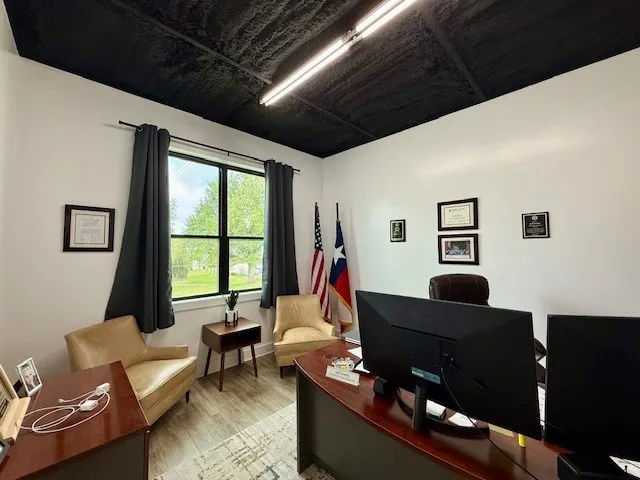 a living room with furniture and a window