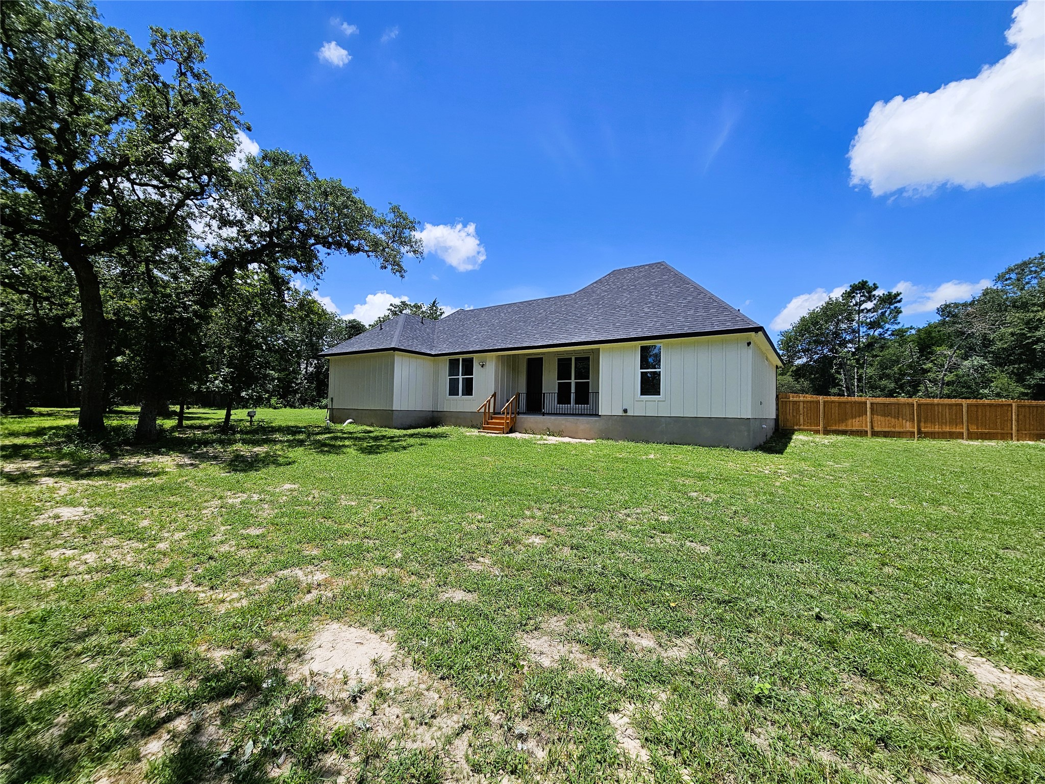 116 Pine Point Cove Elgin, TX 78621 - Photo 27 of 27 A well-maintained lawn embraces this serene dwelling, backed by natural landscaping and a private fence.