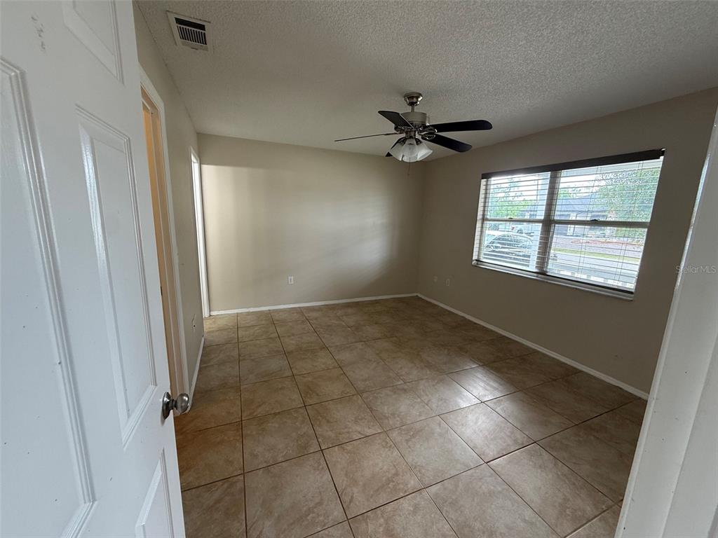 855 Jamaica Road Venice, FL 34293 - Photo 14 of 19 a view of an empty room and a window