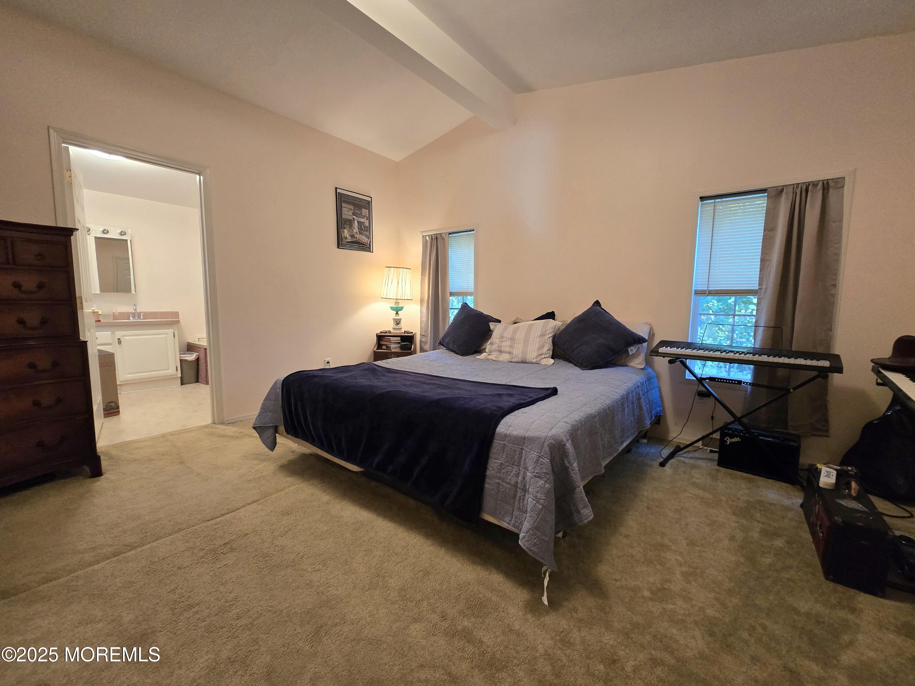 98 Woody Road Freehold, NJ 07728 - Photo 15 of 37 a bedroom with a bed and a dresser