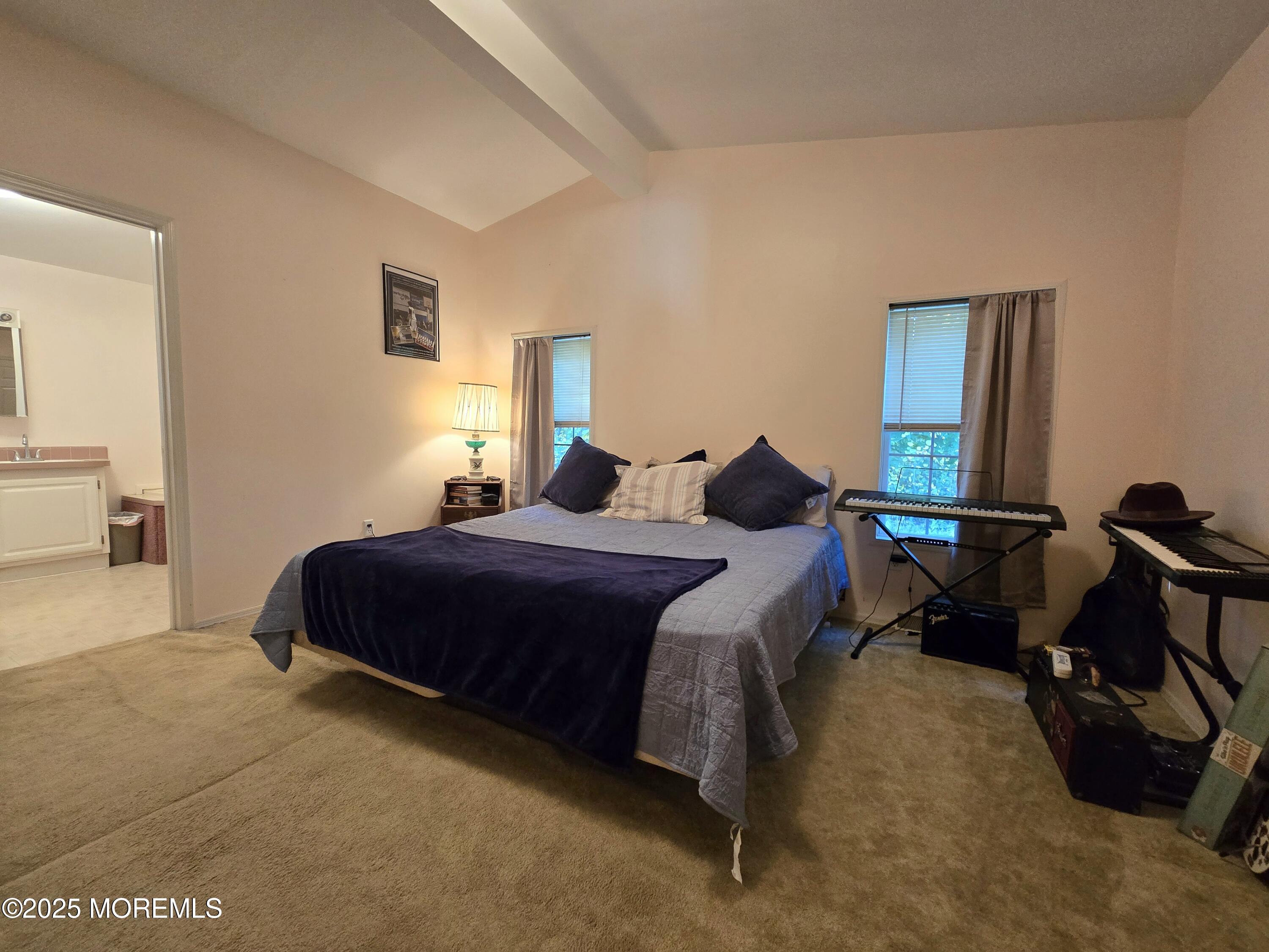 98 Woody Road Freehold, NJ 07728 - Photo 16 of 37 a bedroom with a bed gym equipment and a window