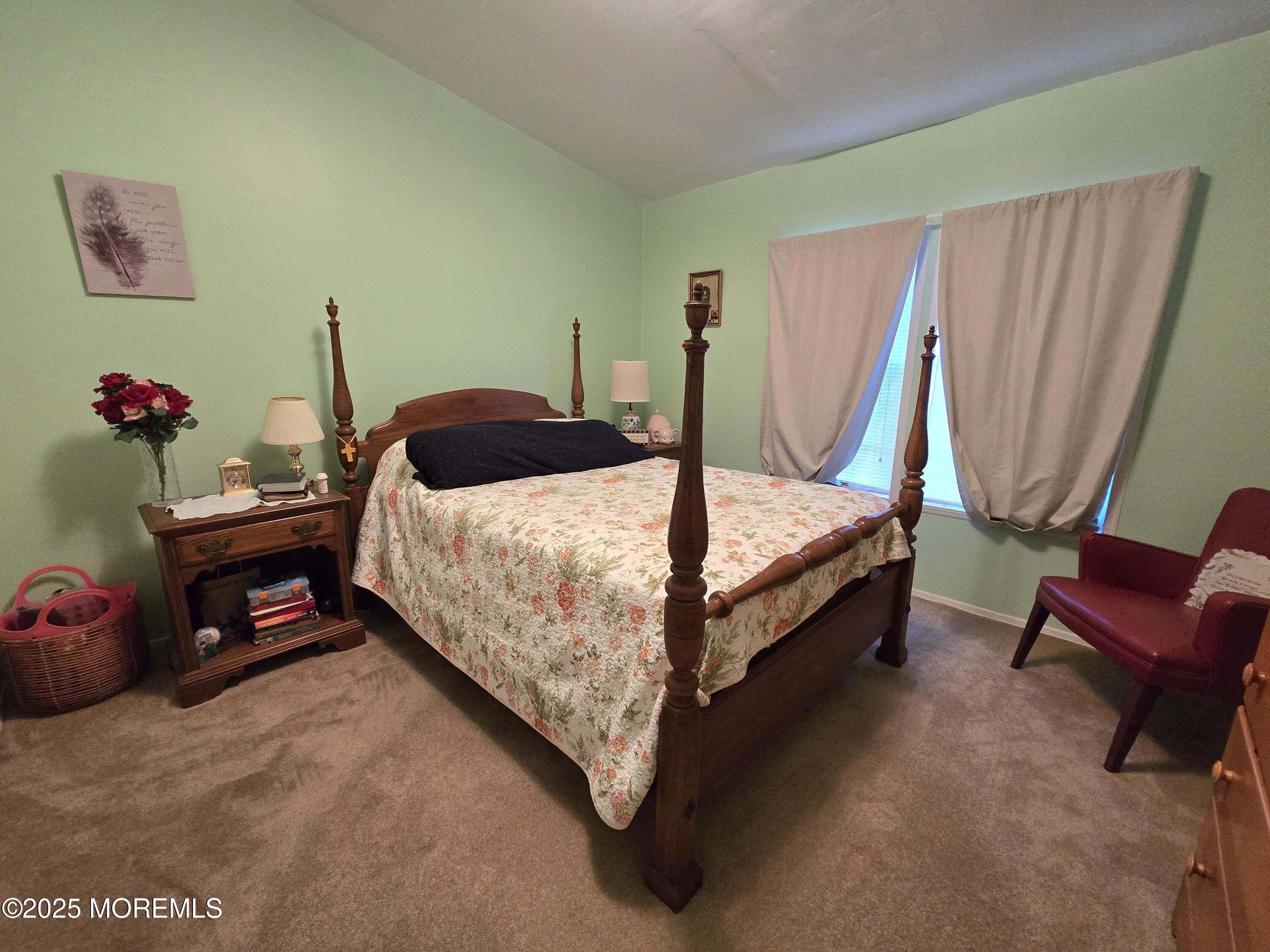 98 Woody Road Freehold, NJ 07728 - Photo 21 of 37 a bedroom with a bed and a chair