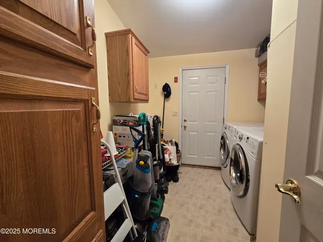 a view of walk in closet with clothes